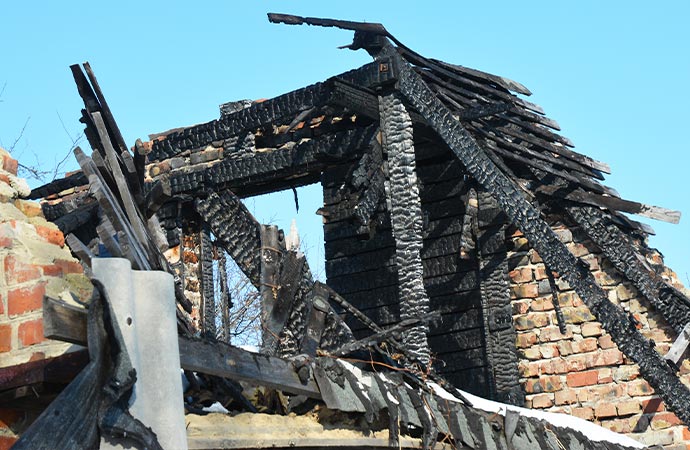 brick house roof structural fire damage old home burns down