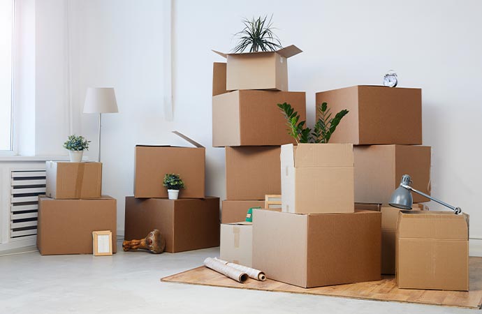 cardboard boxes stacked in empty room professional contents pack out
