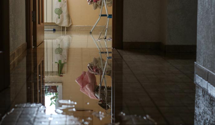 Close up view of a flooded hallway in a house