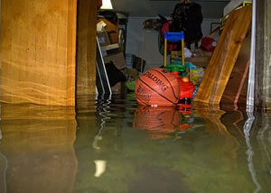 A flooded basement bedroom in